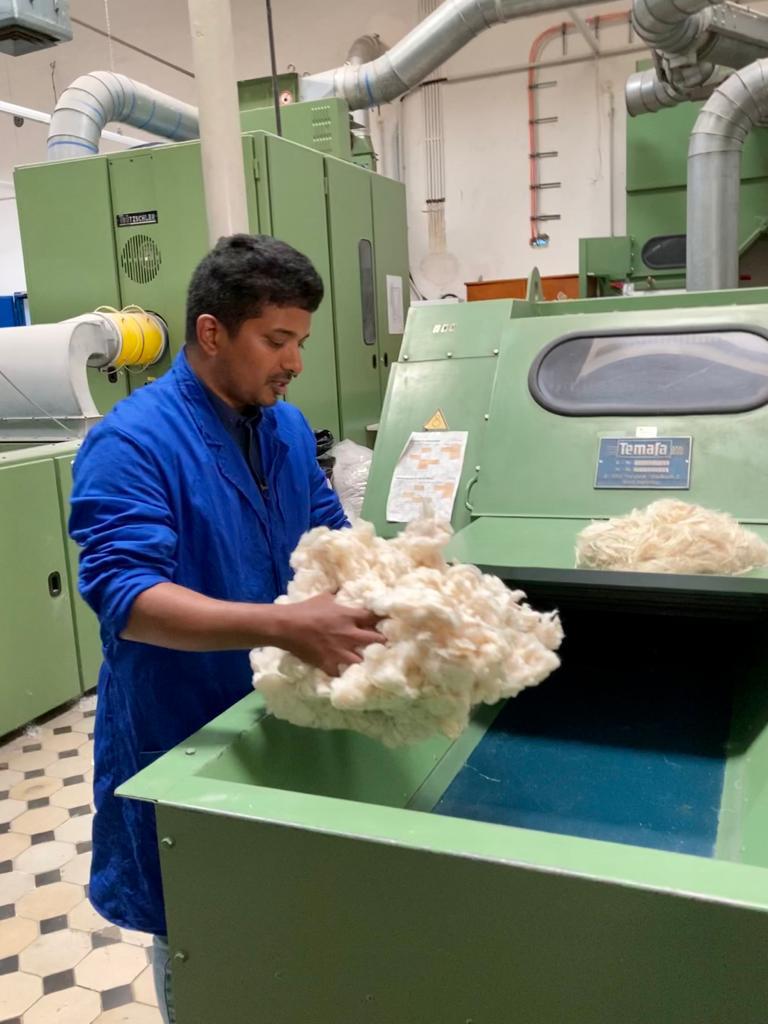Rony Khan handling pineapple leaf fibre on the factory floor at Eco Fresh Agro