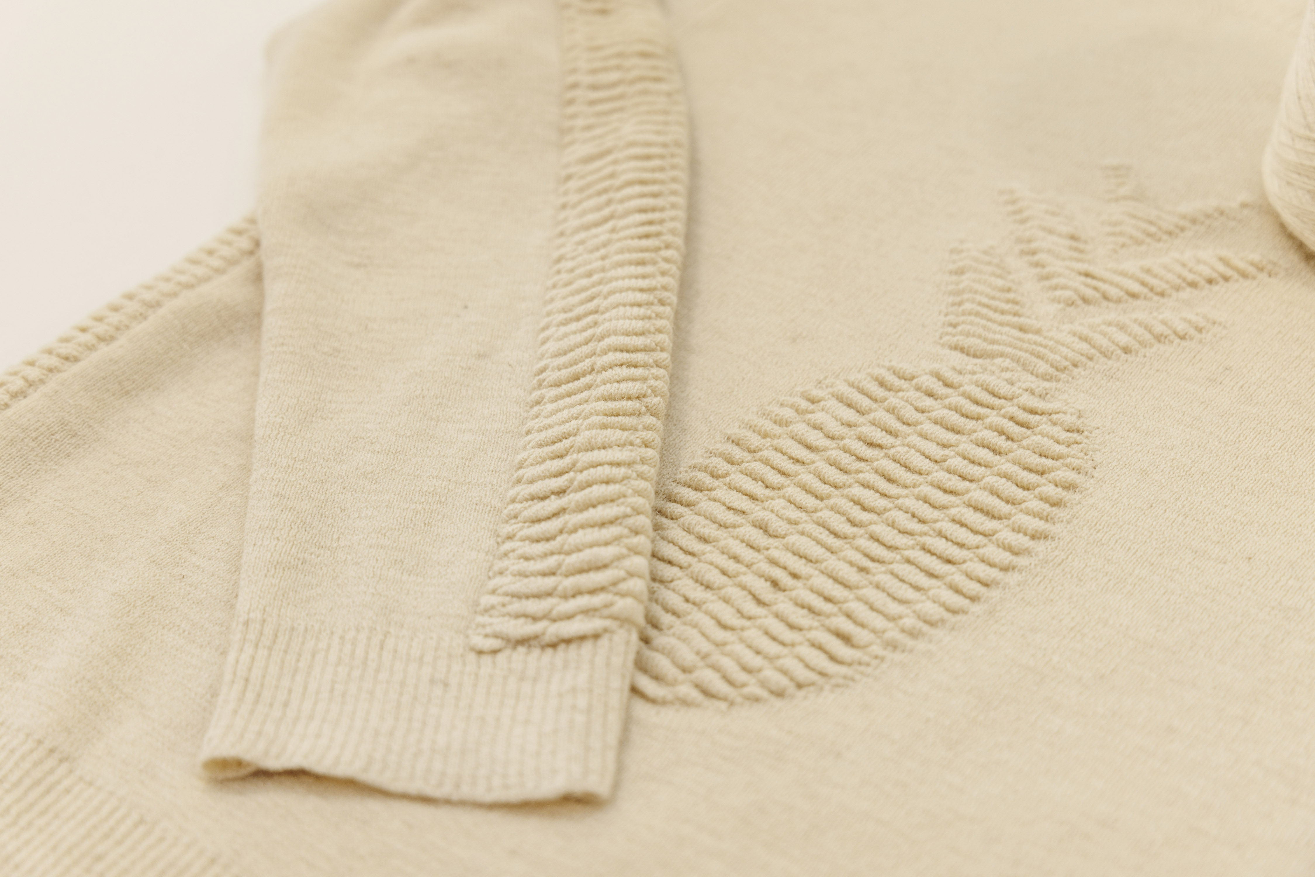 Close-up of the ottoman knit detailing on the Re-Root-Tex x SHIFT sweater